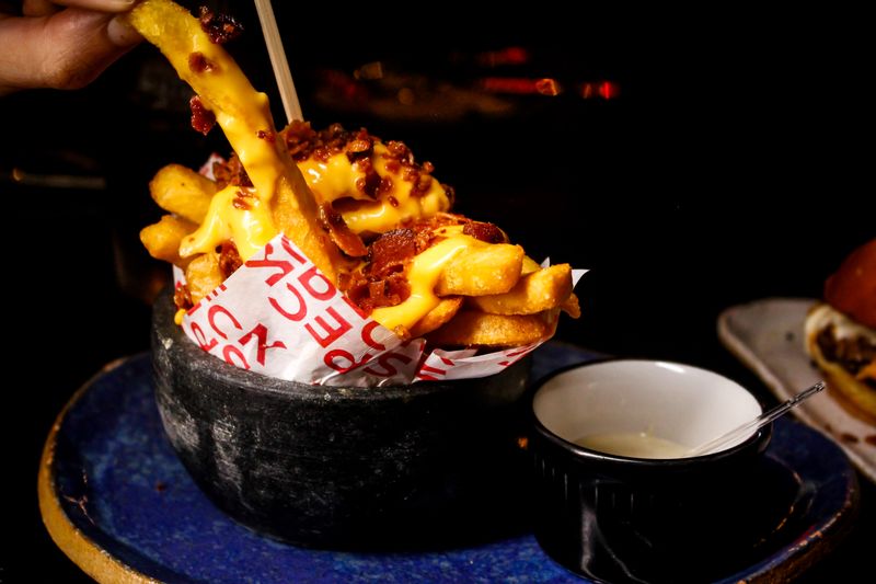 Loaded cheese fries side dish with toppings